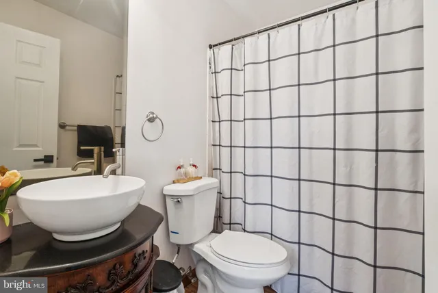 a bathroom with a toilet and a sink