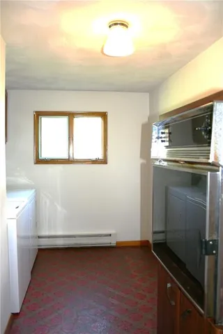 a utility room with washer and dryer