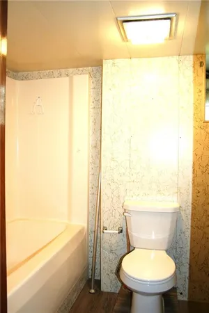 a view of an empty room with closet