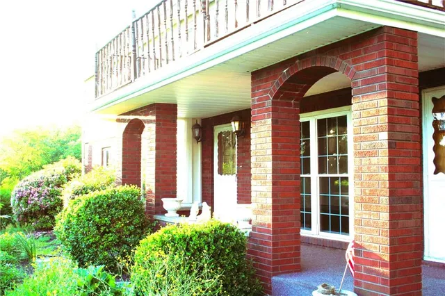 a front view of house with an outdoor space