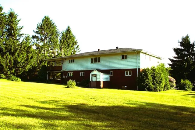 a front view of house with an outdoor space