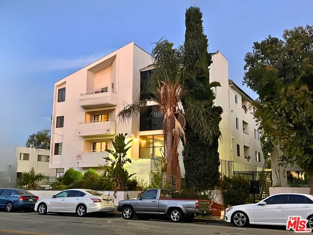 a view of parking with cars parked