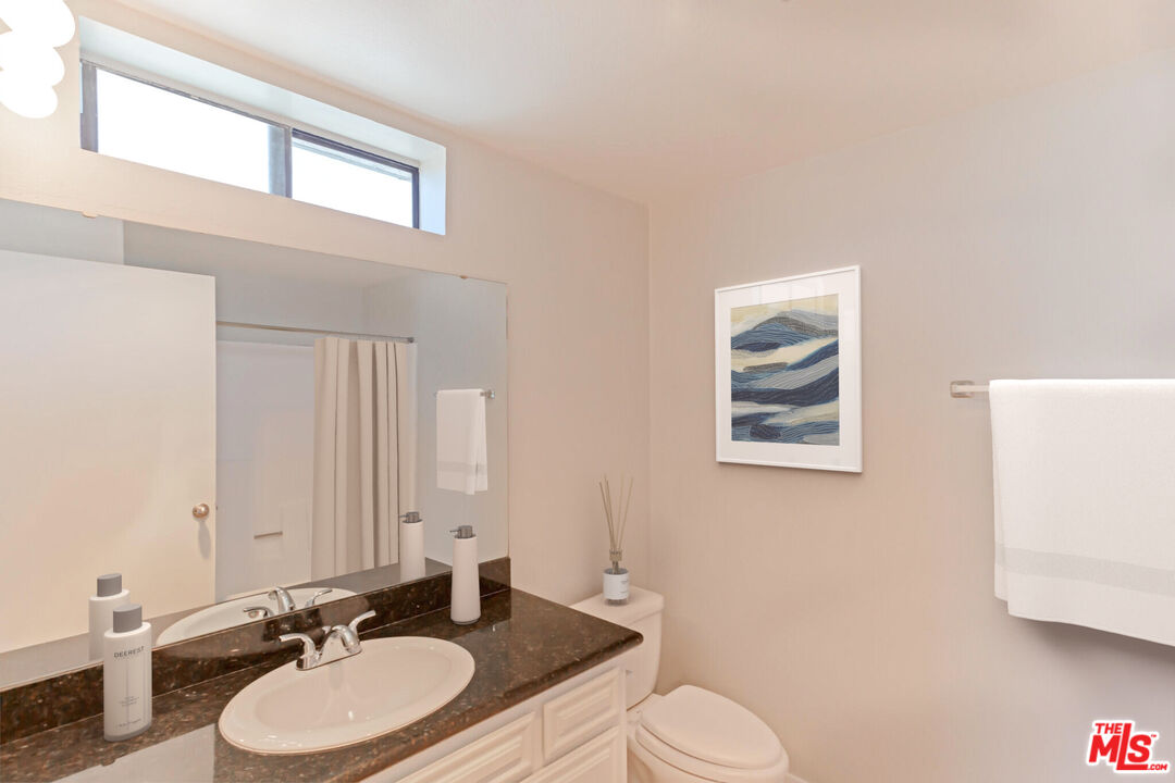 7342 Haskell Avenue Van Nuys, CA 91406 - Photo 5 of 10 a bathroom with a sink and a mirror
