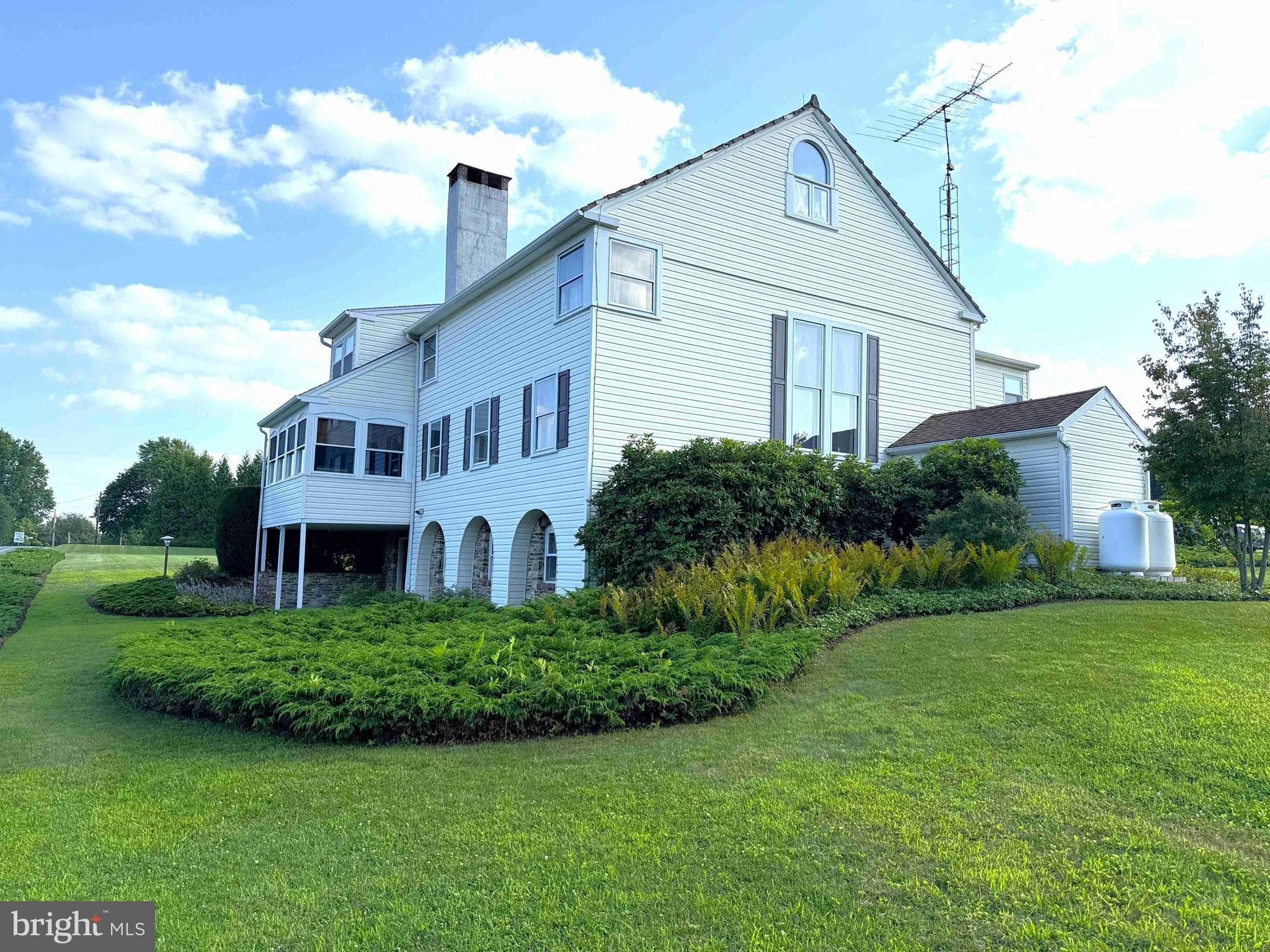 574 Cinder Road New Providence, PA 17560 - Photo 14 of 15 a front view of a house with a yard