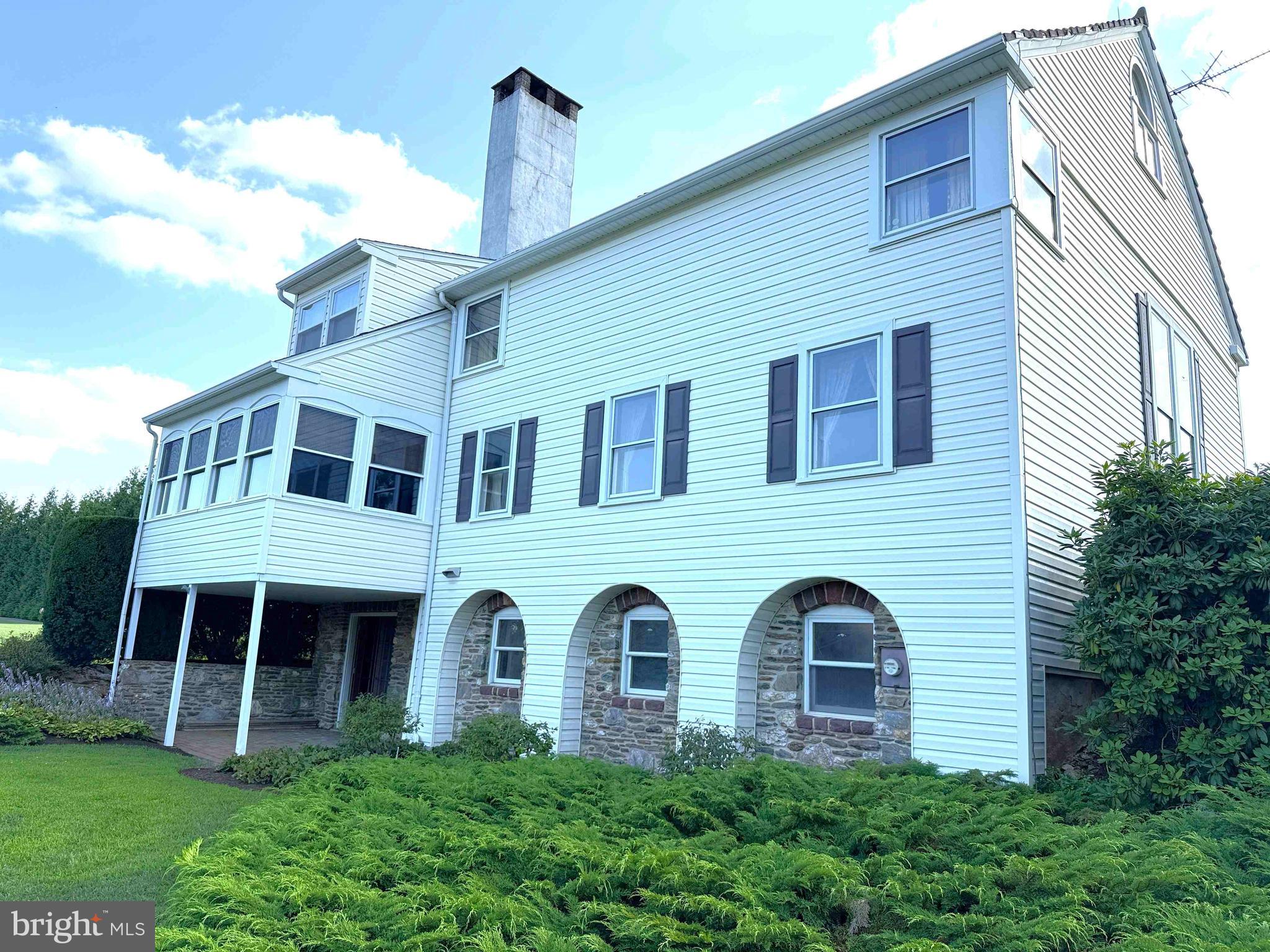 574 Cinder Road New Providence, PA 17560 - Photo 15 of 15 a front view of a house with garden