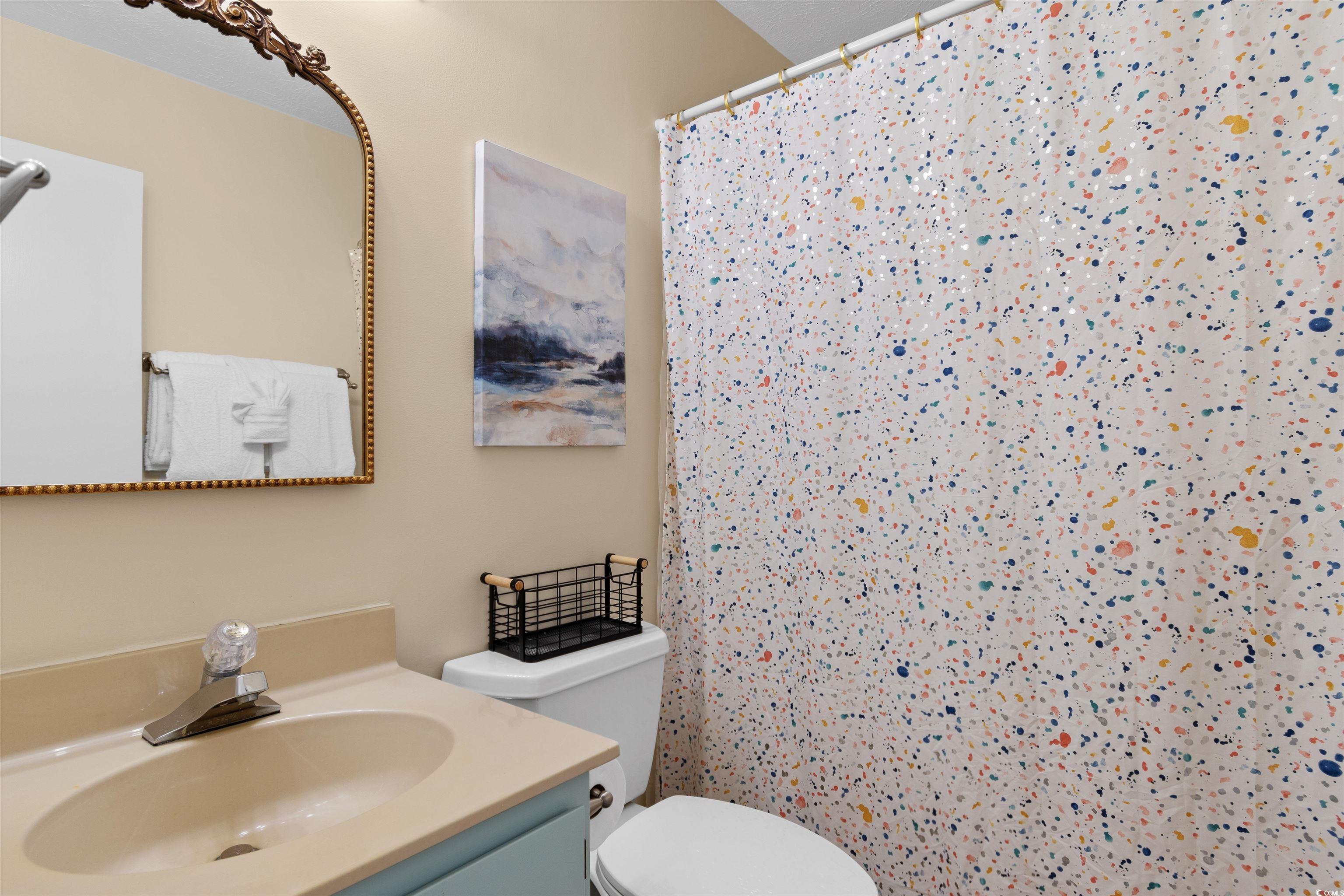 605 A 17th Avenue South North Myrtle Beach, SC 29582 - Photo 18 of 36 Full bath with vanity and curtained shower