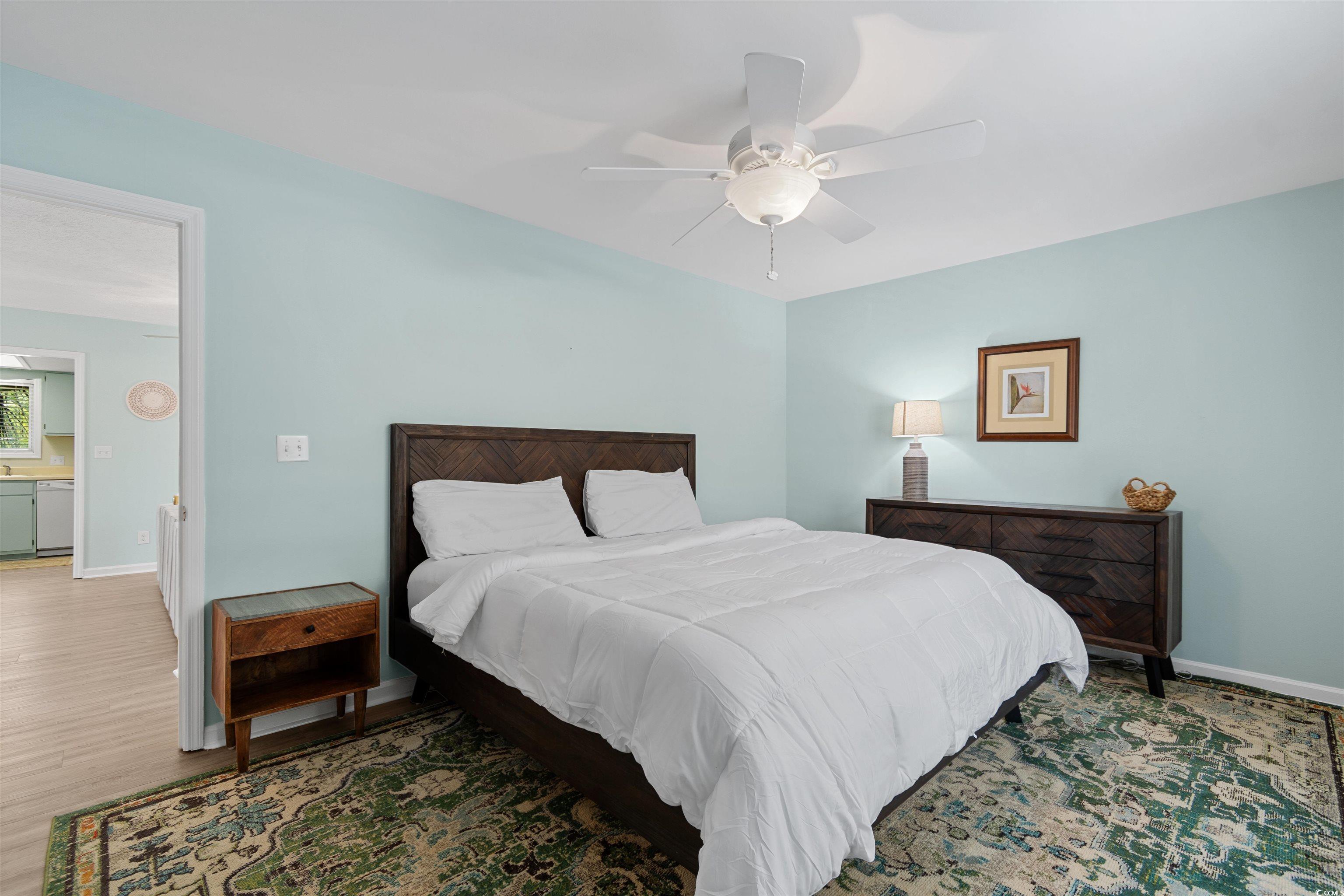 605 A 17th Avenue South North Myrtle Beach, SC 29582 - Photo 20 of 36 Bedroom with ceiling fan and wood finished floors