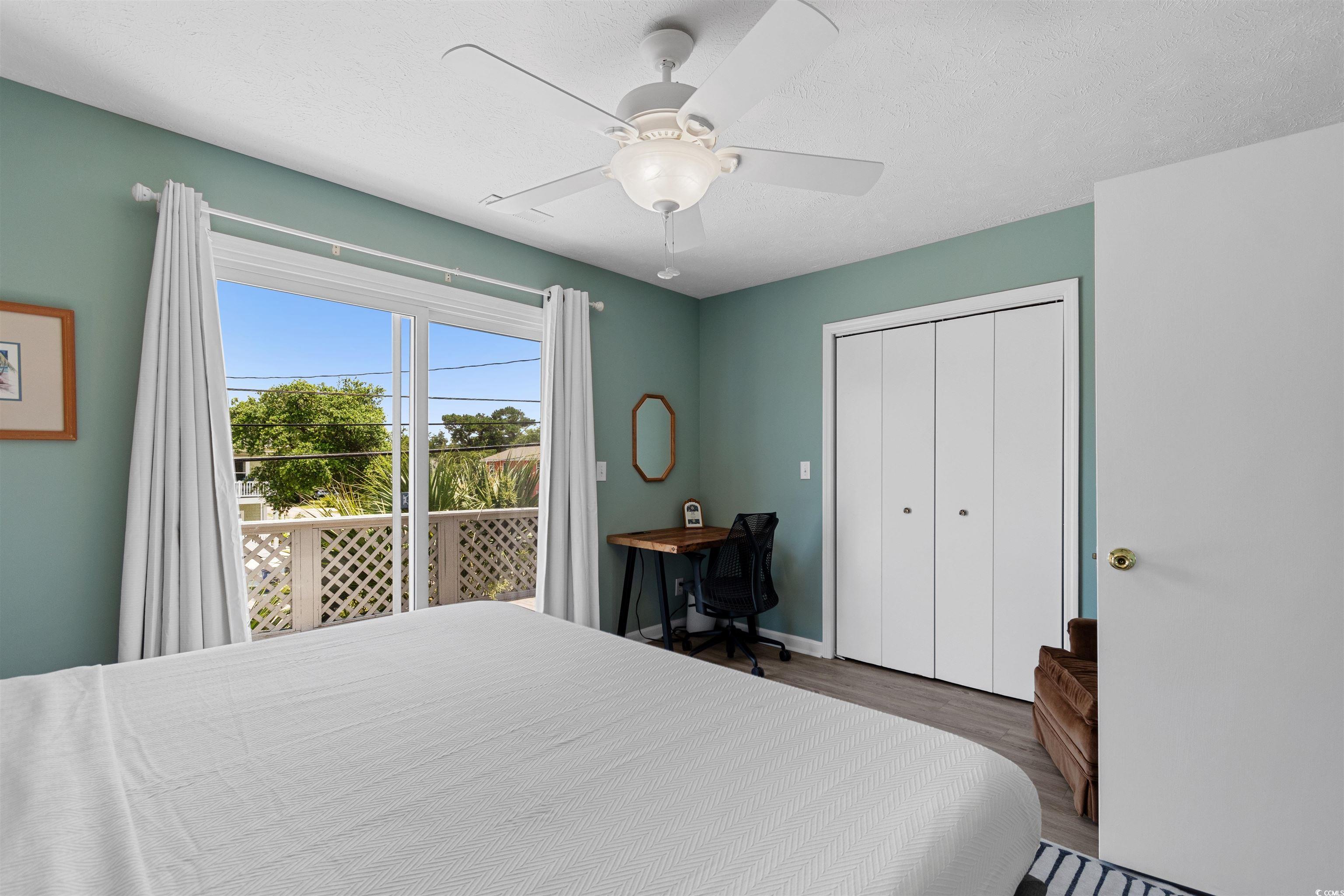 605 A 17th Avenue South North Myrtle Beach, SC 29582 - Photo 27 of 36 Bedroom featuring wood finished floors, a closet, and a ceiling fan