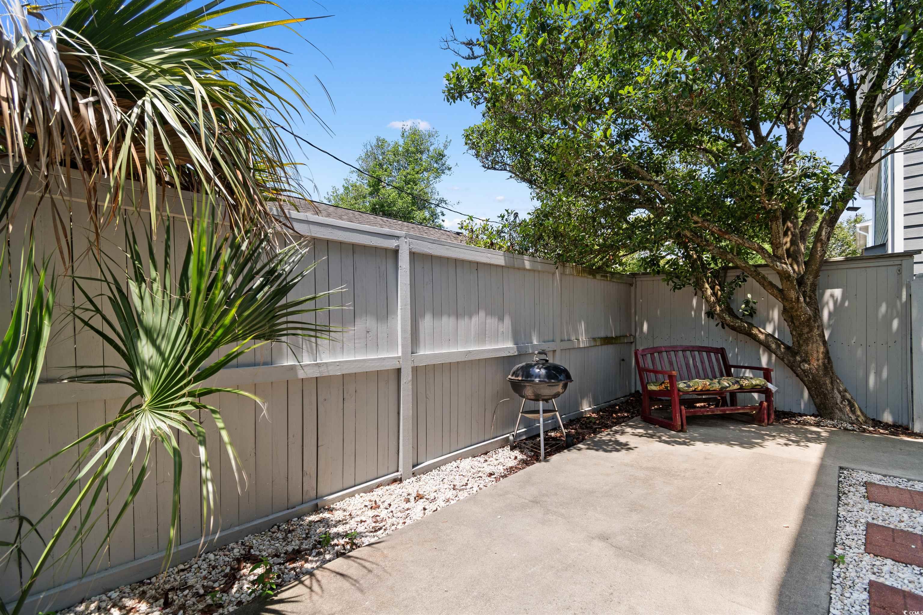 605 A 17th Avenue South North Myrtle Beach, SC 29582 - Photo 29 of 36 Fenced backyard with grilling area