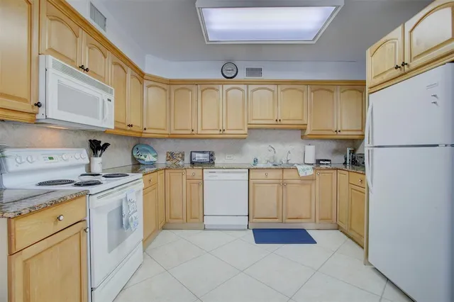 a room with a bed and a large window