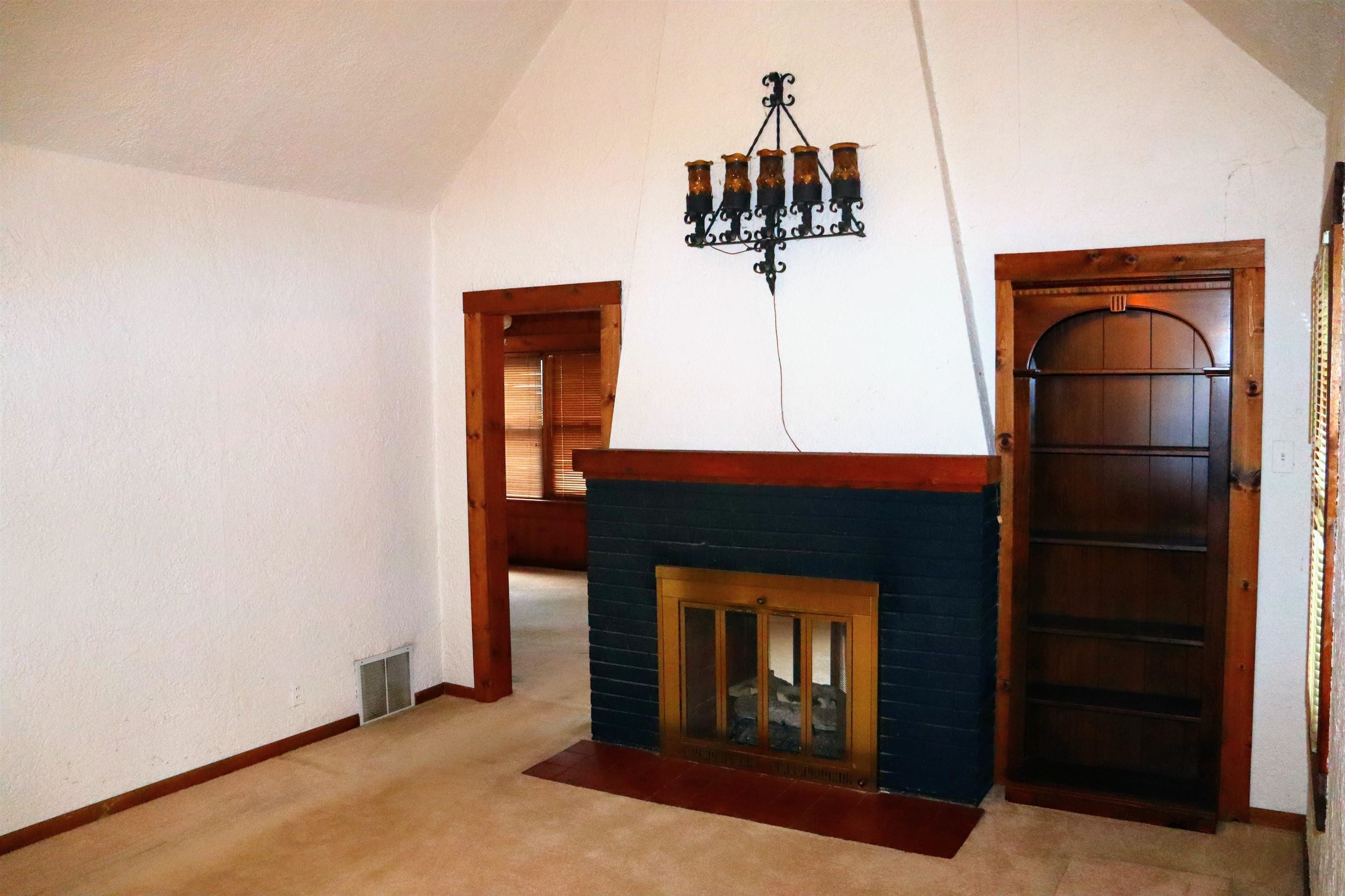 470 Brookside Road North Barrington, IL 60010 - Photo 21 of 38 a room with a fireplace and a ceiling fan