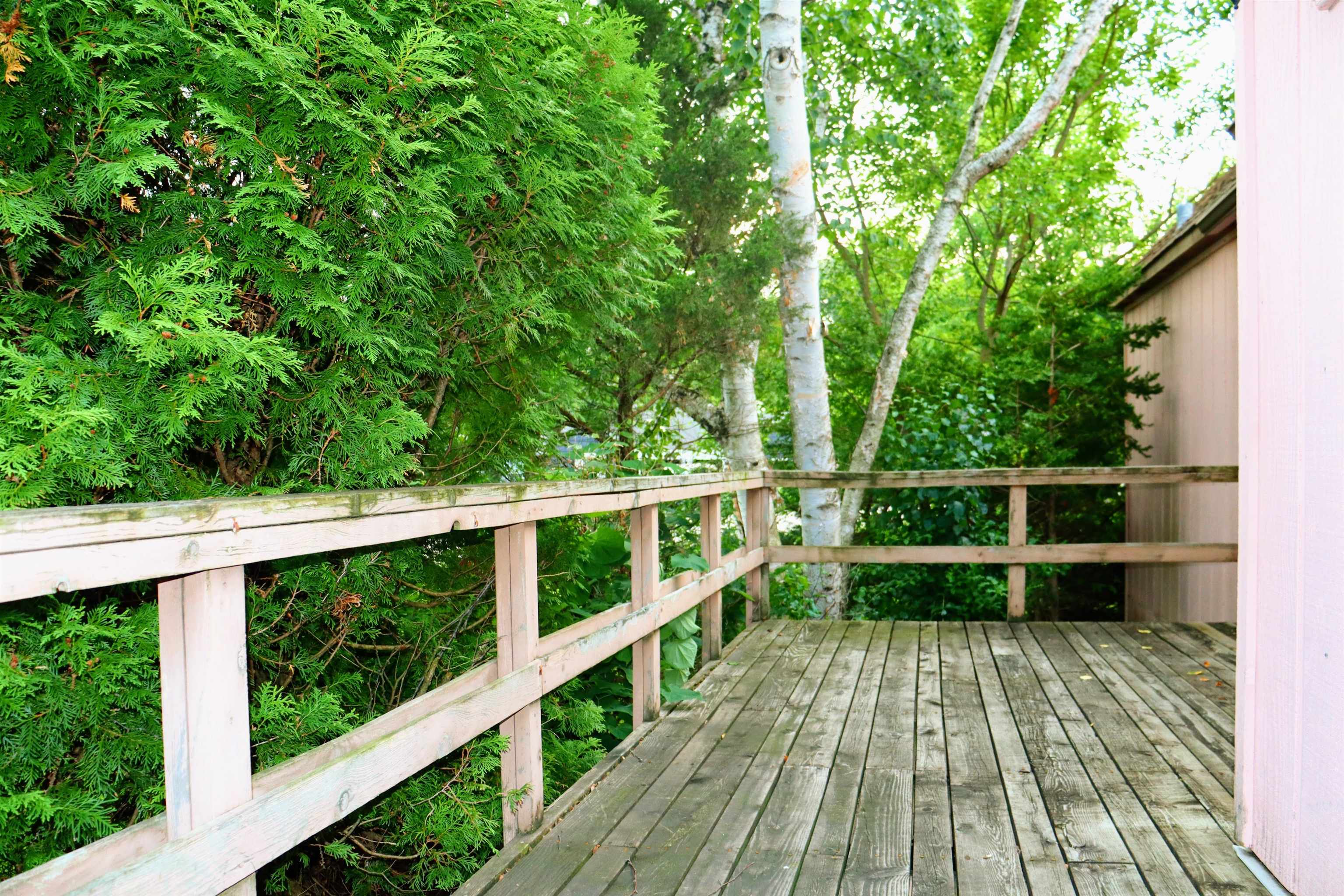 470 Brookside Road North Barrington, IL 60010 - Photo 3 of 38 a view of a balcony with wooden floor and fence