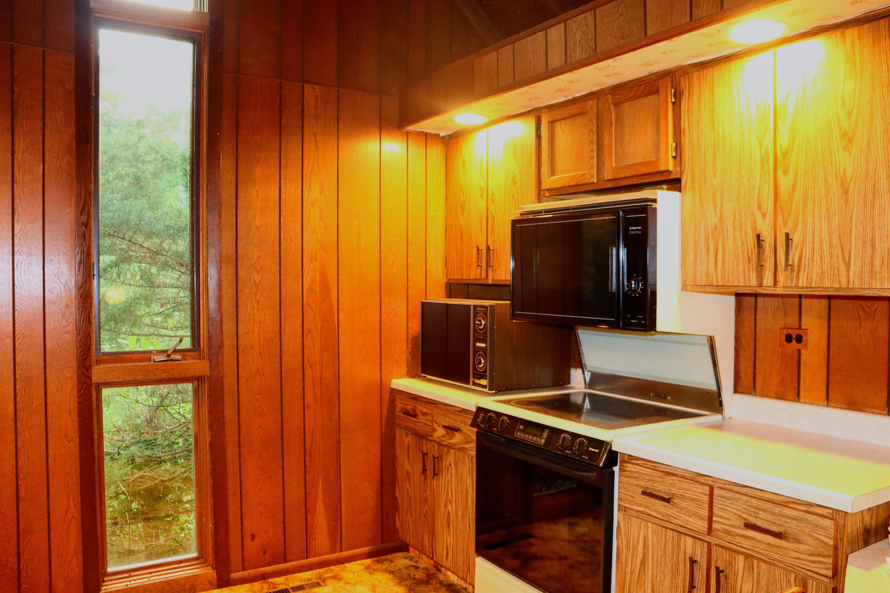 470 Brookside Road North Barrington, IL 60010 - Photo 8 of 38 a kitchen with stainless steel appliances a stove a microwave and a sink