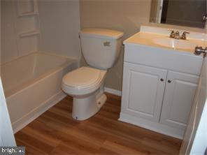 88 High Meadows Drive Sicklerville, NJ 08081 - Photo 7 of 9 a white toilet sitting next to a bathroom sink