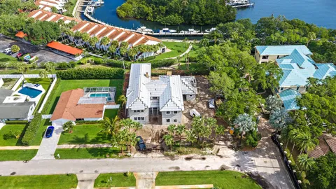 an aerial view of a residential houses with outdoor space and street view