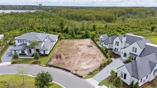 an aerial view of a house with a garden and swimming pool