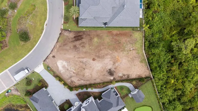 an aerial view of a house with a garden