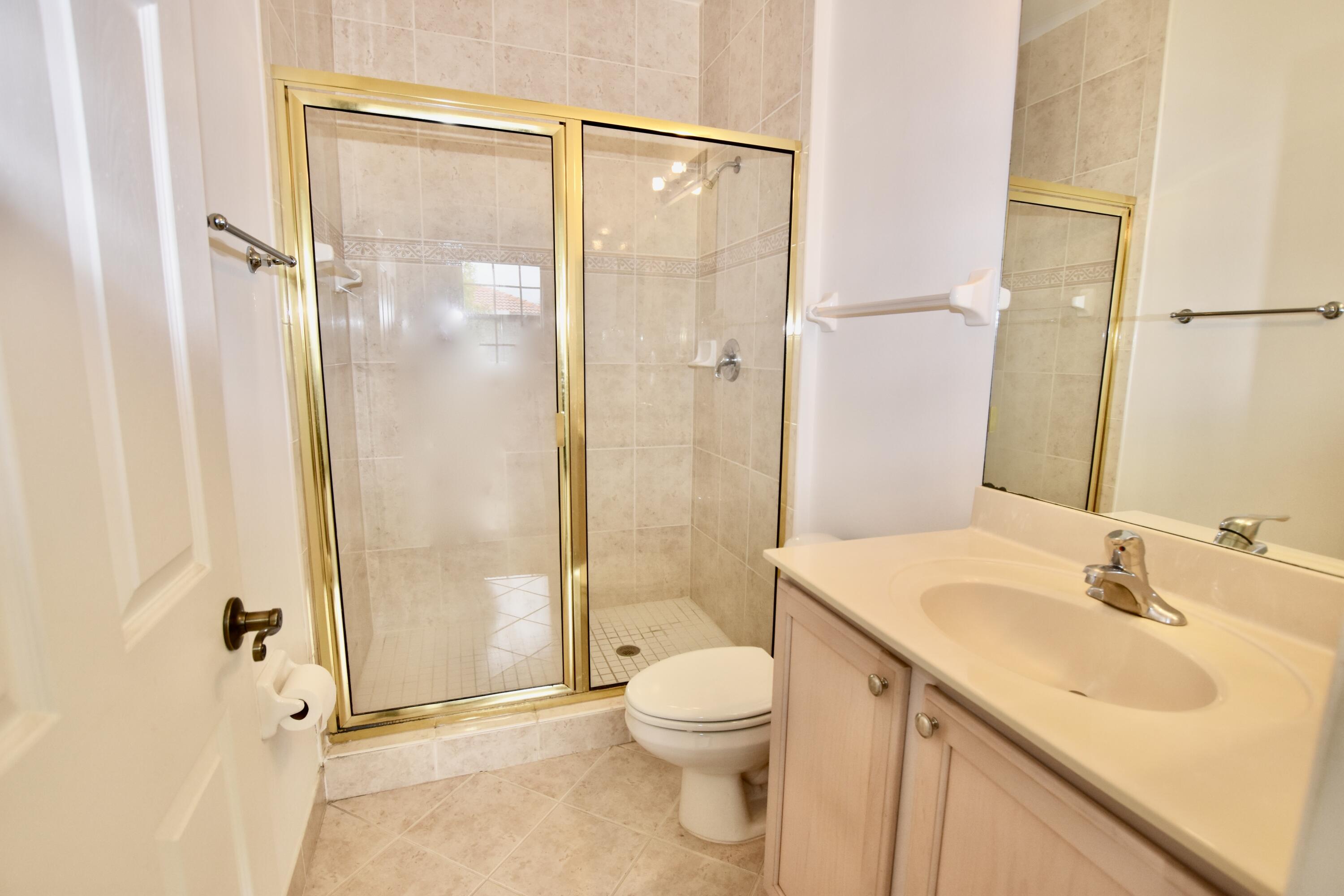 106 Lighthouse Circle, Unit J Tequesta, FL 33469 - Photo 11 of 32 Primary Bedroom Ensuite Bathroom