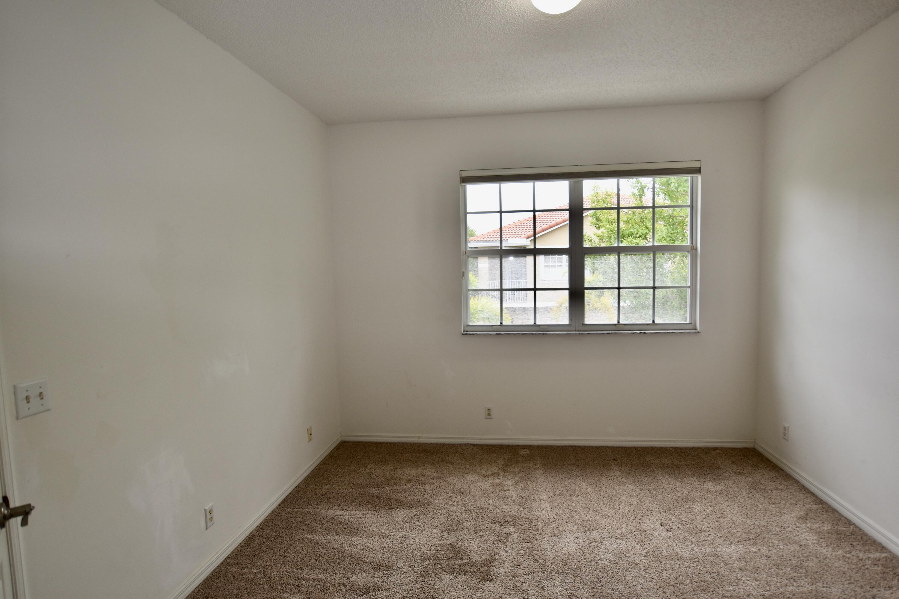 106 Lighthouse Circle, Unit J Tequesta, FL 33469 - Photo 10 of 32 Primary Bedroom