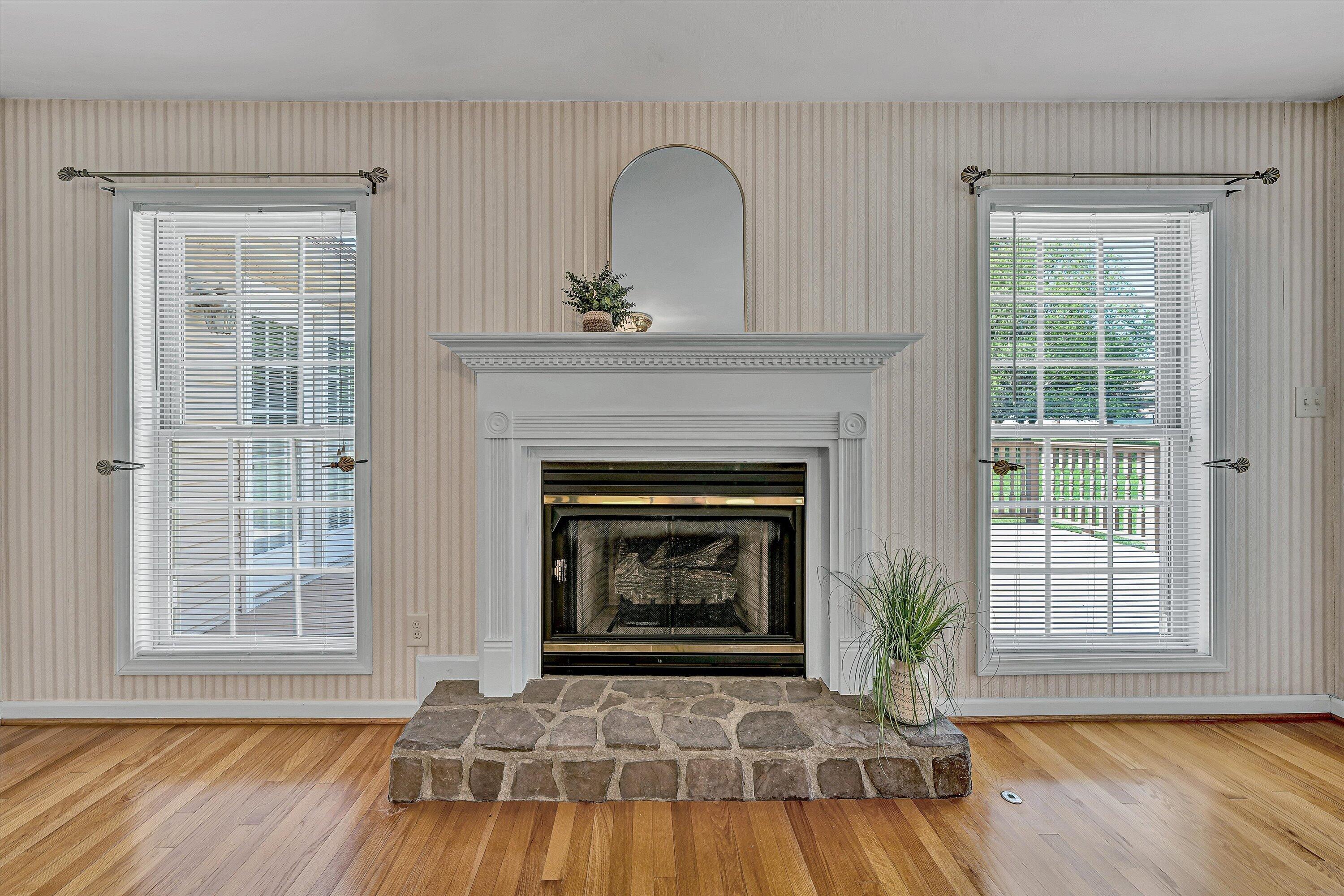 3516 Pinnacle Ridge Road Northeast Roanoke, VA 24012 - Photo 11 of 39 a living room with a fireplace and wooden floor