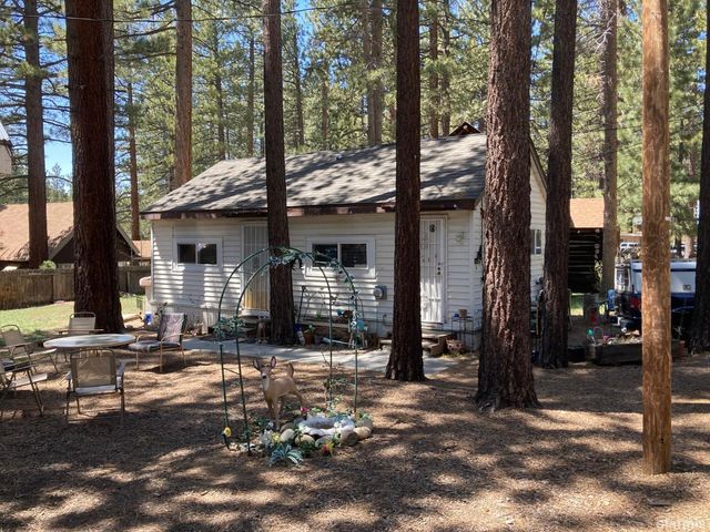 a front view of a house with street view