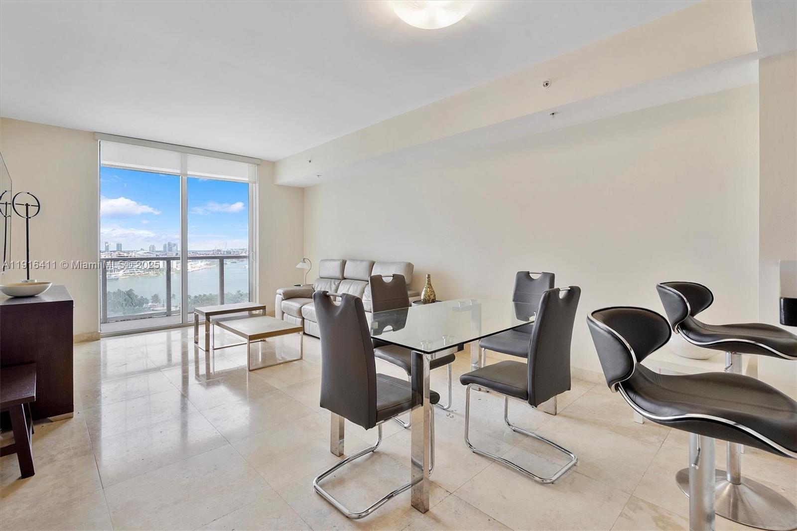 253 Northeast 2nd Street, Unit 1803 Miami, FL 33132 - Photo 4 of 23 a view of a workspace with furniture