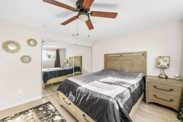 a bedroom with a bed and a dresser