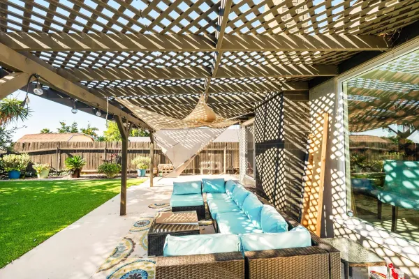 a building outdoor space with patio furniture and potted plants