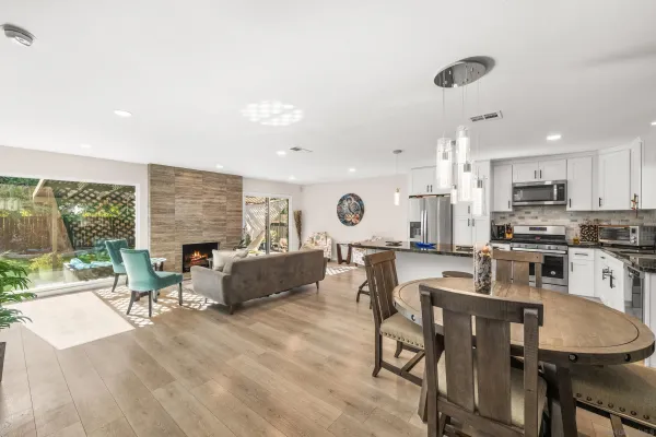 a large kitchen with a table and chairs