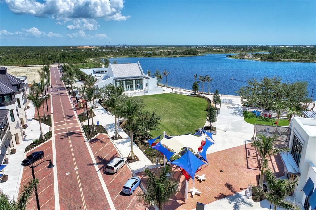 4266 Summertree Road Venice, FL 34293 - Photo 50 of 64 an aerial view of a house with a lake view