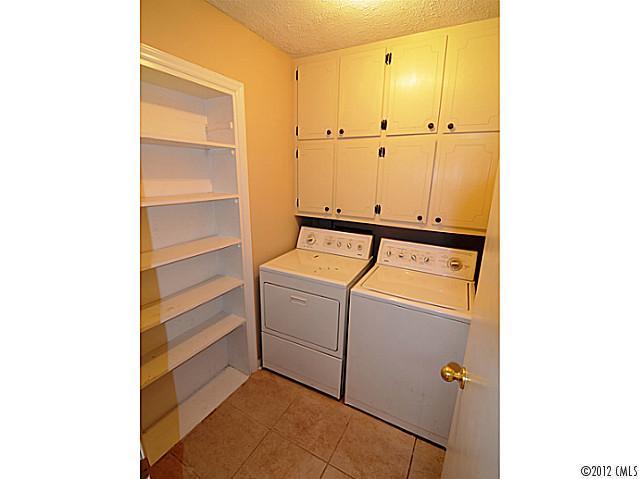 1314 Erinshire Road Charlotte, NC 28211 - Photo 14 of 16 a view of storage and utility room with washer and dryer