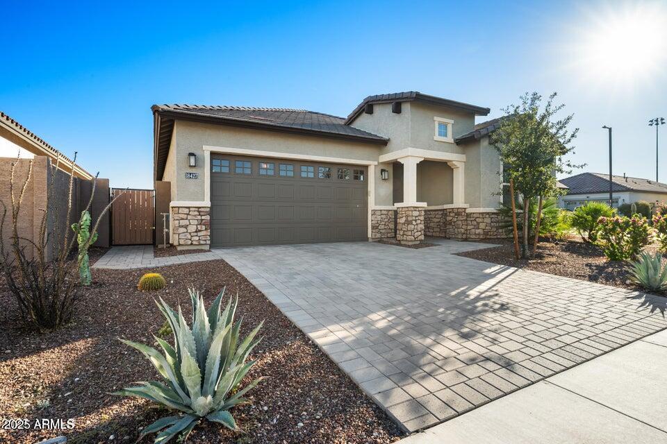18427 West Clinton Street Surprise, AZ 85388 - Photo 6 of 6 a front view of a house with garden
