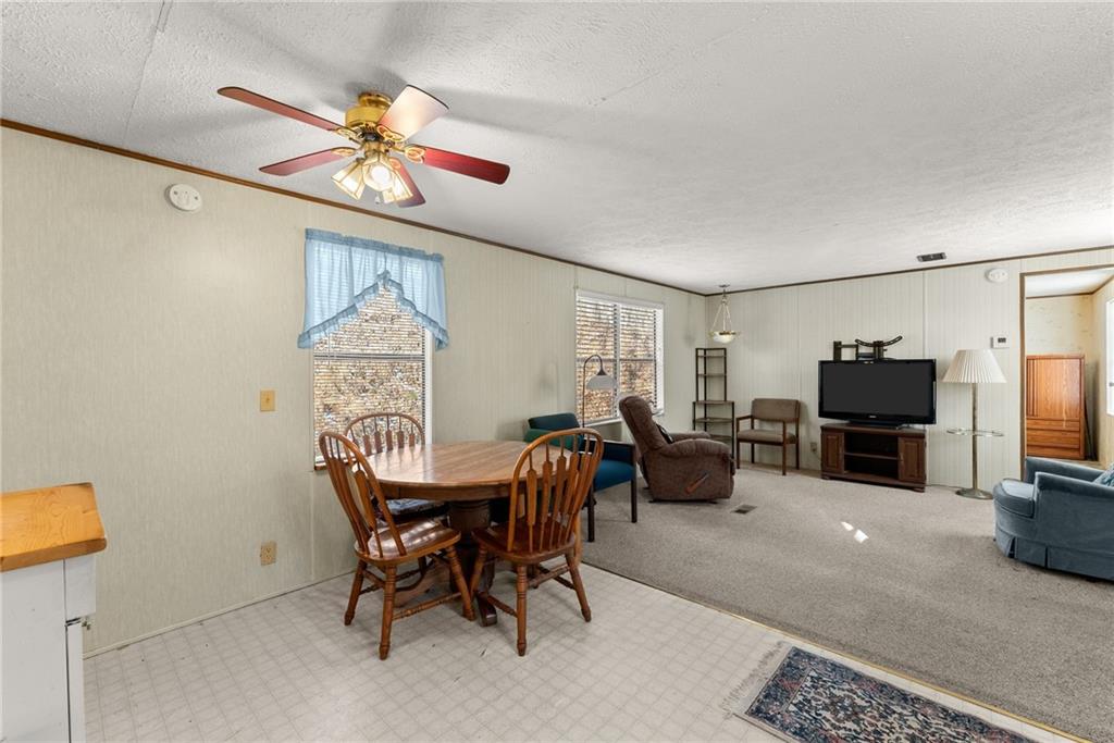 347 Norma Road Dawsonville, GA 30534 - Photo 11 of 33 a dining room with furniture and window