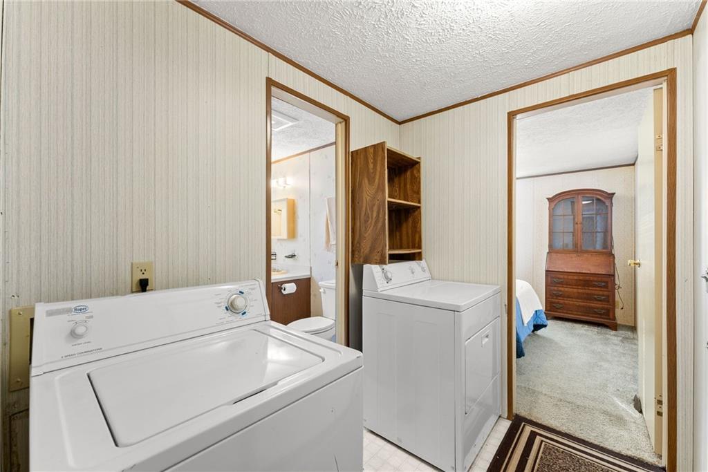 347 Norma Road Dawsonville, GA 30534 - Photo 13 of 33 a utility room with dryer and washer