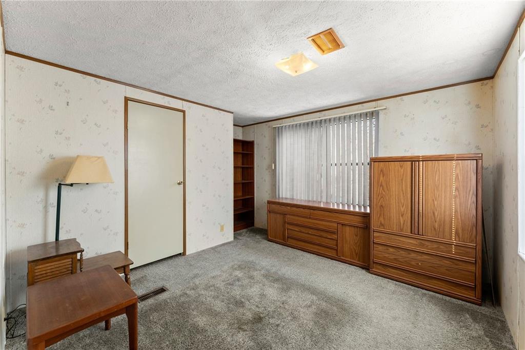 347 Norma Road Dawsonville, GA 30534 - Photo 17 of 33 a view of an empty room with cabinet and a window