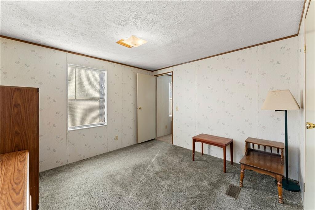 347 Norma Road Dawsonville, GA 30534 - Photo 18 of 33 a view of an empty room with a window