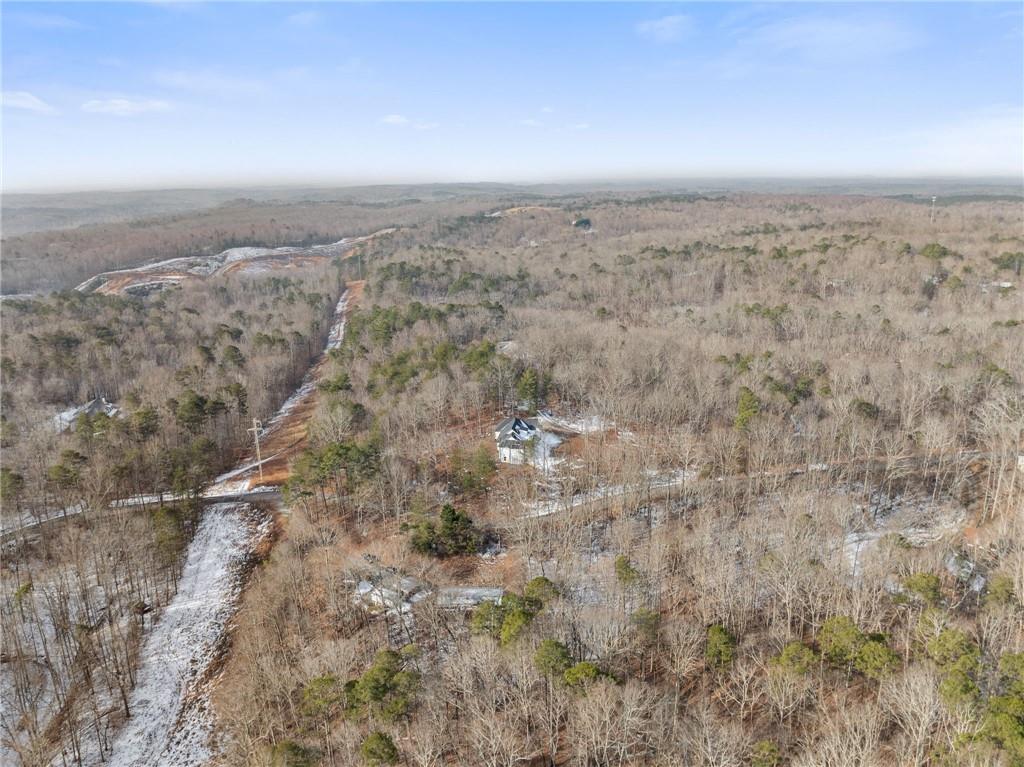 347 Norma Road Dawsonville, GA 30534 - Photo 32 of 33 an aerial view of house with yard and mountain view in back