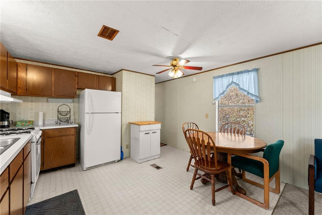347 Norma Road Dawsonville, GA 30534 - Photo 10 of 33 a view of a dining room with furniture and wooden floor