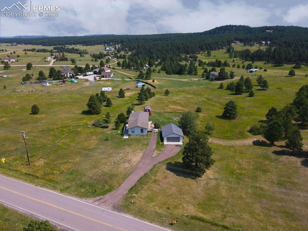4130 Walker Road Colorado Springs, CO 80908 - Photo 38 of 39 Aerial view of property and surrounding area with rural landscape