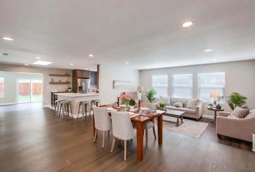 8348 Rumson Drive Santee, CA 92071 - Photo 12 of 53 a view of a dining room with furniture and wooden floor