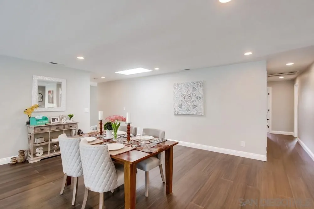 8348 Rumson Drive Santee, CA 92071 - Photo 15 of 53 a view of a dining room with furniture and wooden floor