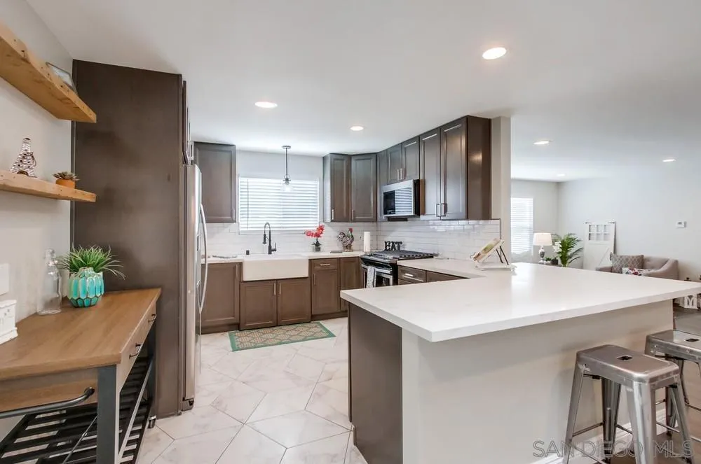 8348 Rumson Drive Santee, CA 92071 - Photo 18 of 53 a kitchen with a sink a stove a refrigerator and a stove