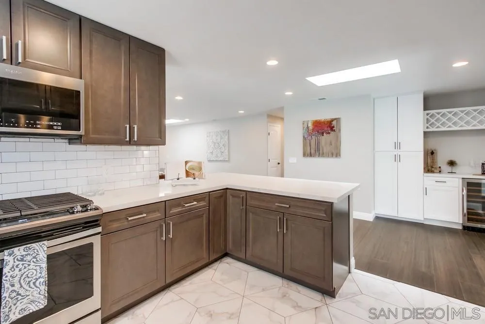 8348 Rumson Drive Santee, CA 92071 - Photo 19 of 53 a kitchen that has a sink and a stove top oven