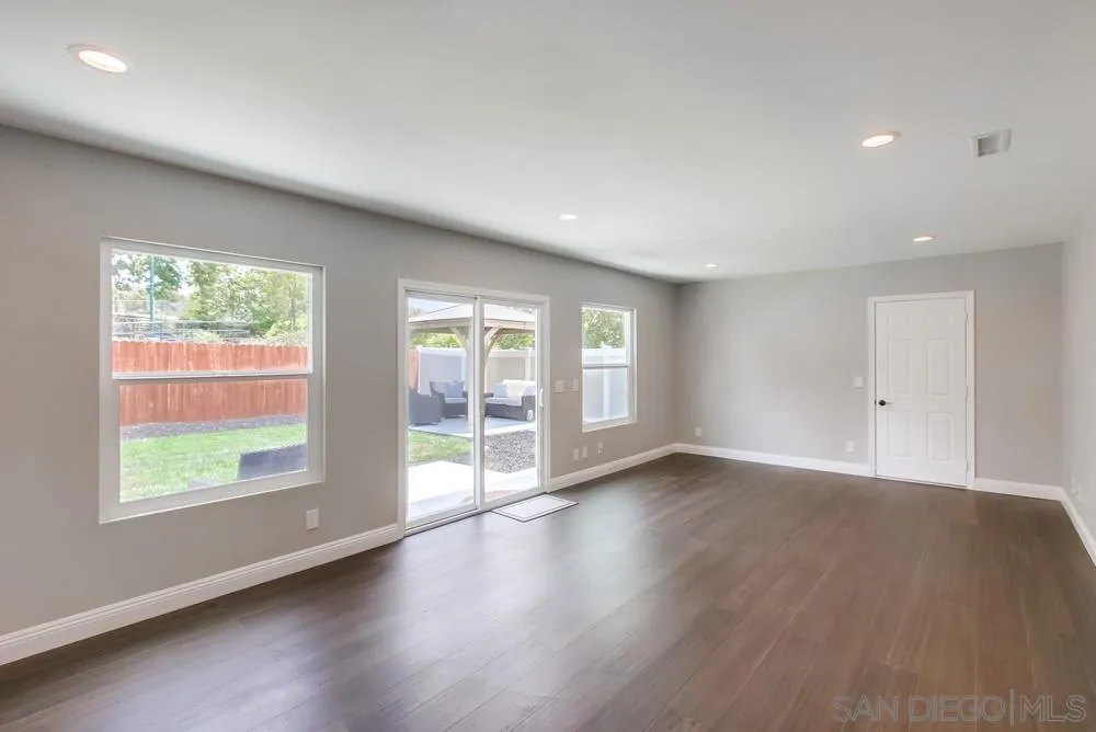 8348 Rumson Drive Santee, CA 92071 - Photo 23 of 53 an empty room with wooden floor and windows