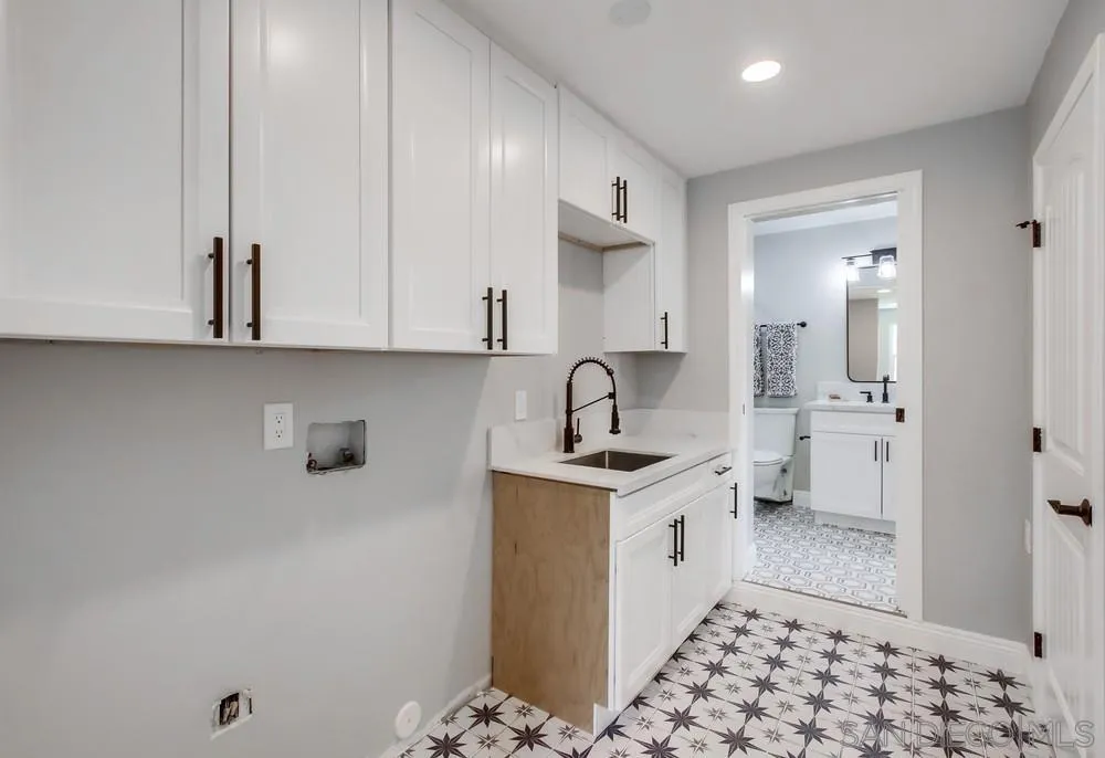 8348 Rumson Drive Santee, CA 92071 - Photo 39 of 53 a kitchen with a sink and cabinets