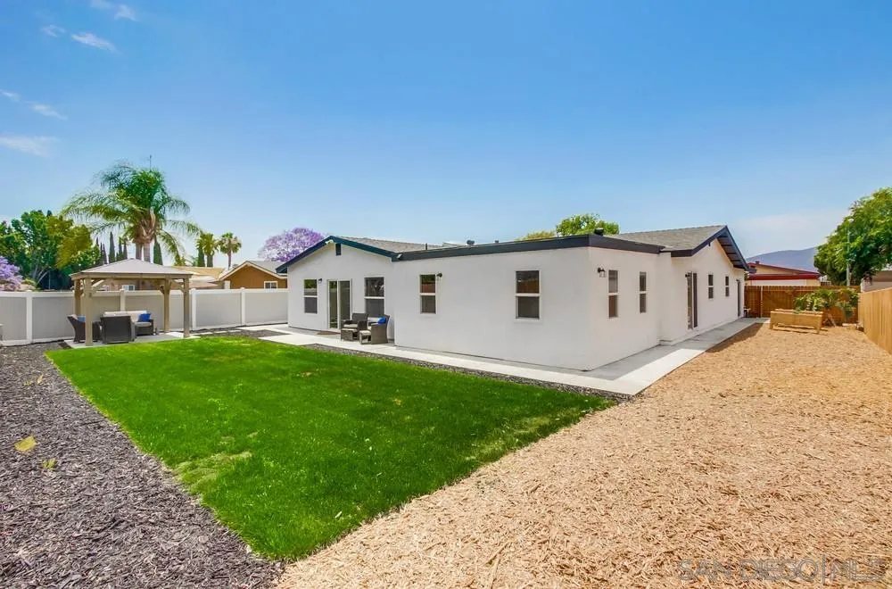 8348 Rumson Drive Santee, CA 92071 - Photo 46 of 53 a view of a house with a yard and a garden