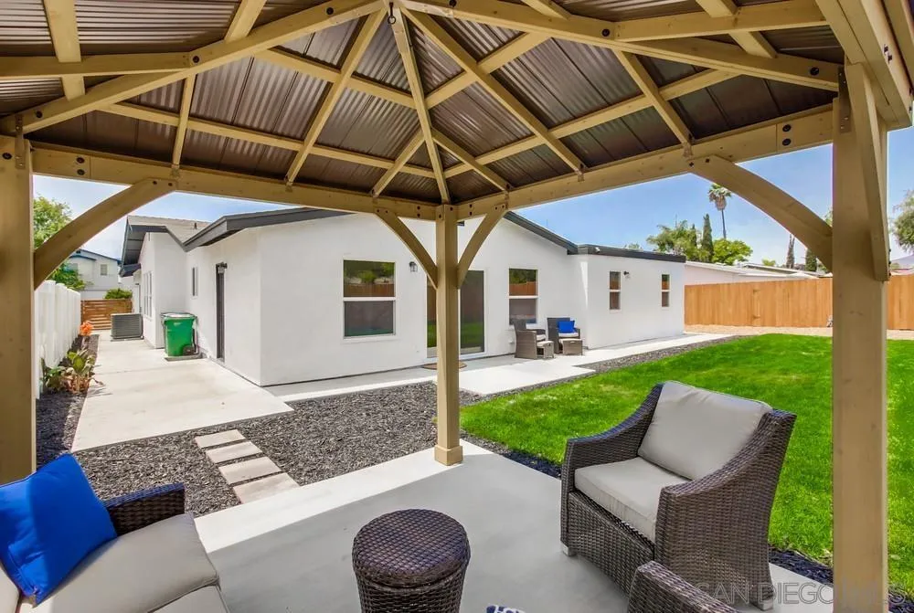 8348 Rumson Drive Santee, CA 92071 - Photo 48 of 53 a view of a patio with a table and chairs under an umbrella
