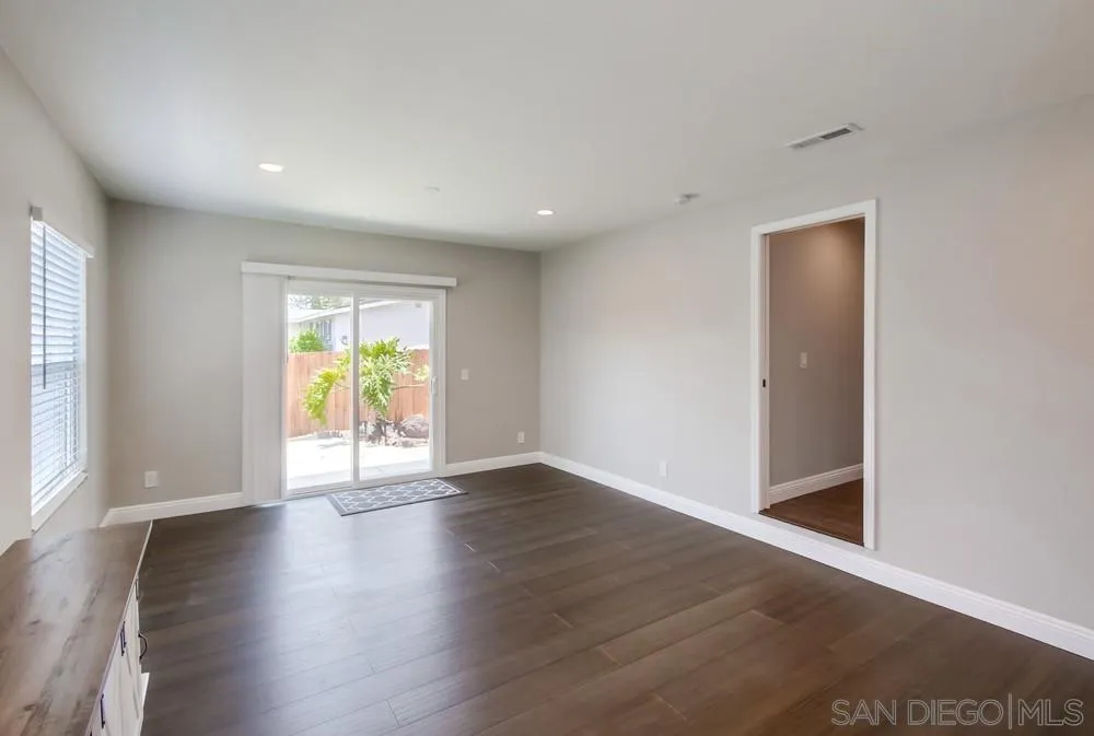 8348 Rumson Drive Santee, CA 92071 - Photo 8 of 53 an empty room with wooden floor and a window