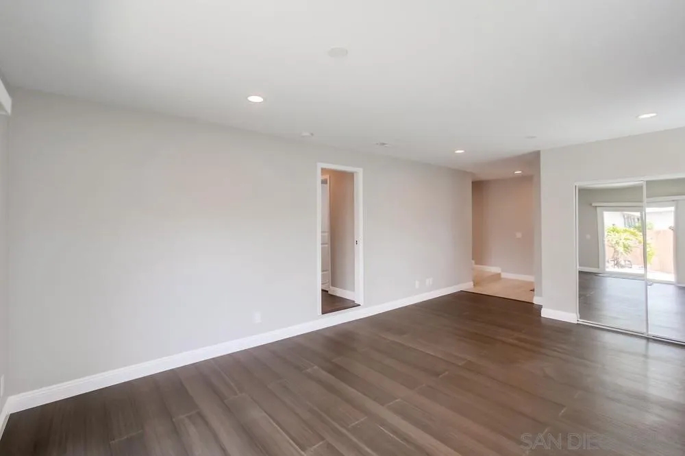8348 Rumson Drive Santee, CA 92071 - Photo 10 of 53 a view of an empty room with wooden floor and a window