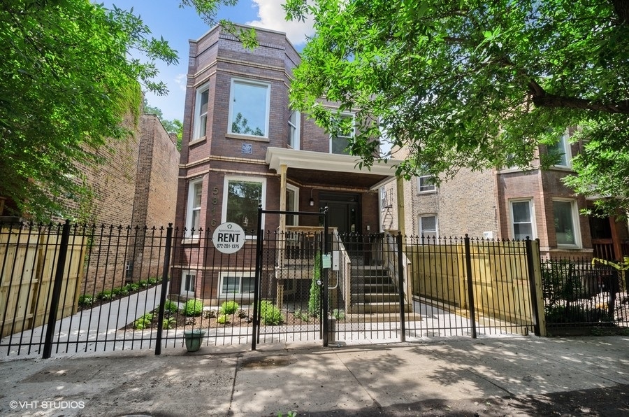 5816 North Ridge Avenue, Unit 1F Chicago, IL 60660 - Photo 1 of 18 front view of a building with a garden